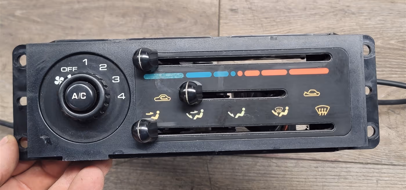 a climate control component of a vehicle held over a table