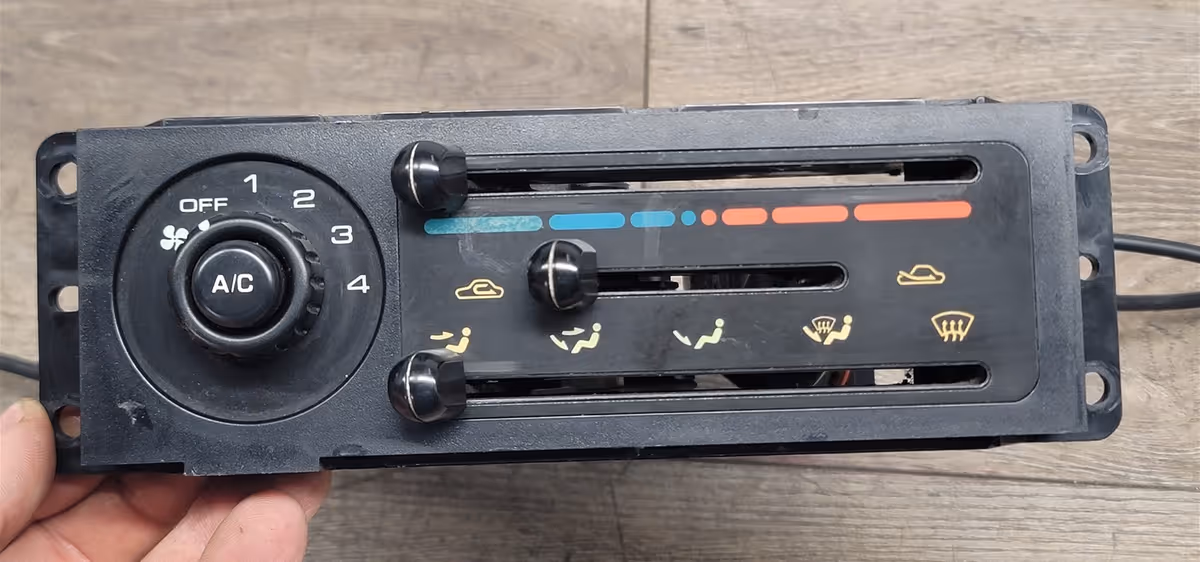 a climate control component of a vehicle held over a table